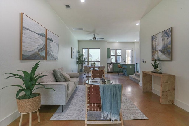 living room featuring recessed lighting, visible vents, and baseboards