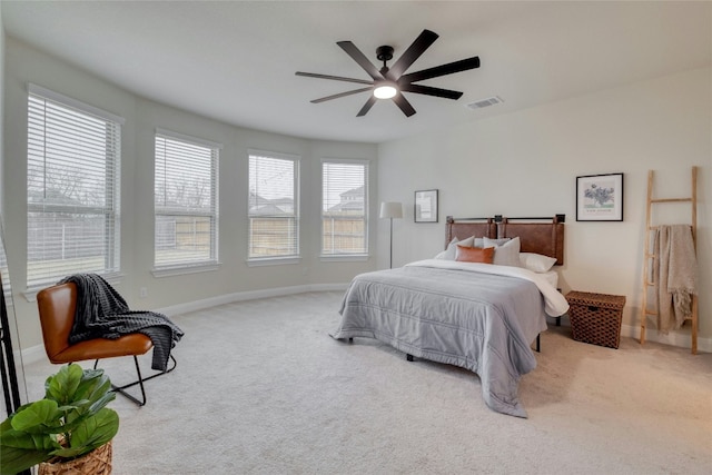 bedroom with ceiling fan and light colored carpet