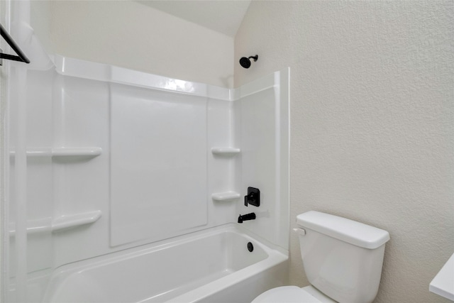 bathroom featuring toilet and shower / bathing tub combination