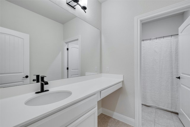 bathroom with tile patterned floors, vanity, and curtained shower