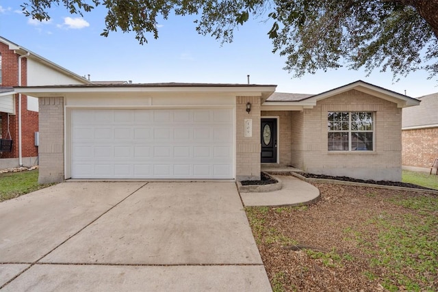 ranch-style house featuring a garage