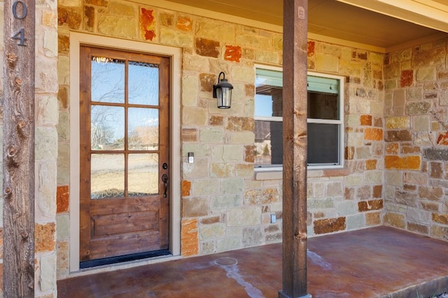 entrance to property with stone siding