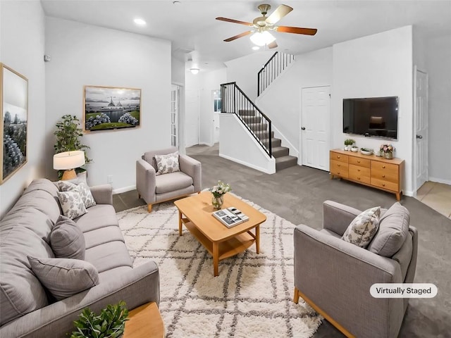 carpeted living room featuring ceiling fan