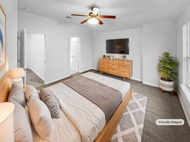 carpeted bedroom featuring lofted ceiling and ceiling fan