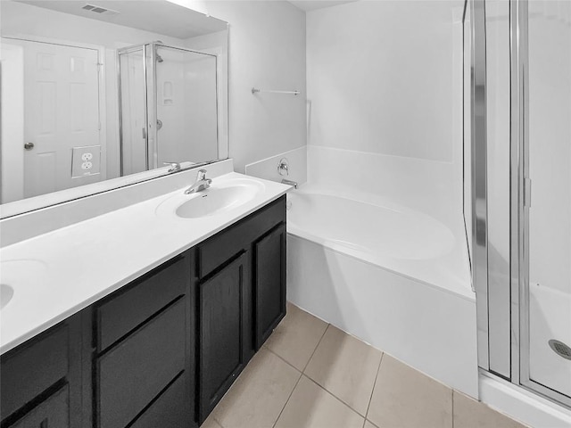 bathroom with vanity, separate shower and tub, and tile patterned floors