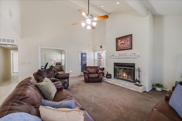 carpeted living room featuring beamed ceiling, high vaulted ceiling, and ceiling fan