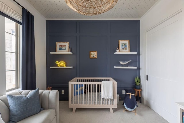 carpeted bedroom featuring multiple windows and crown molding