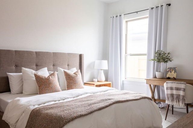 bedroom featuring light colored carpet