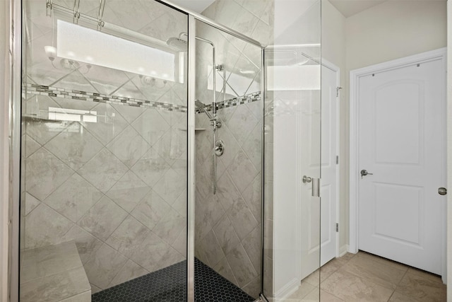 bathroom with a shower with shower door