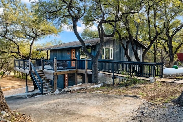 rear view of property with a wooden deck