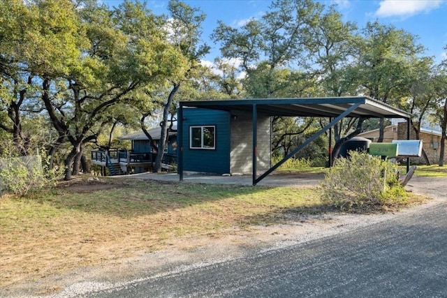 exterior space with a carport