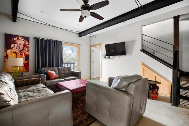 living room with ceiling fan and beam ceiling