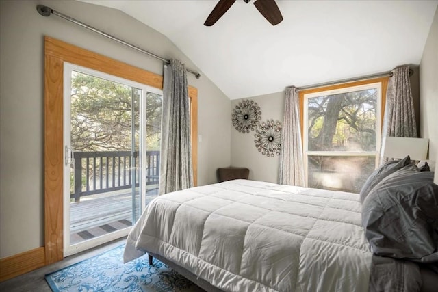 bedroom with lofted ceiling, access to exterior, multiple windows, and ceiling fan