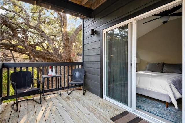 wooden terrace featuring ceiling fan