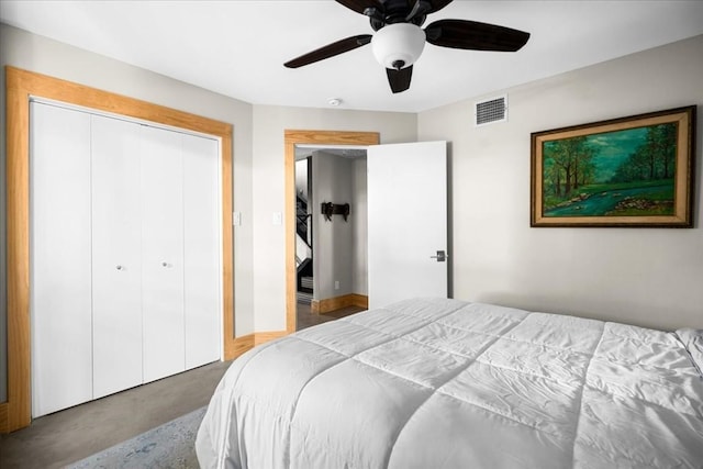 bedroom with ceiling fan and a closet