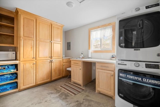 kitchen with stacked washer / drying machine, electric panel, sink, and light brown cabinets