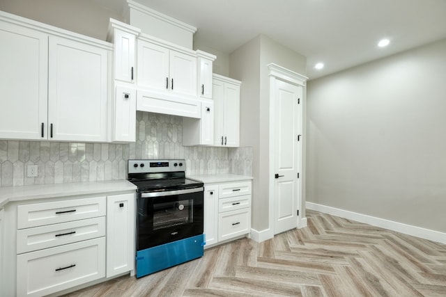 kitchen with white cabinetry, light parquet flooring, stainless steel range with electric cooktop, and decorative backsplash