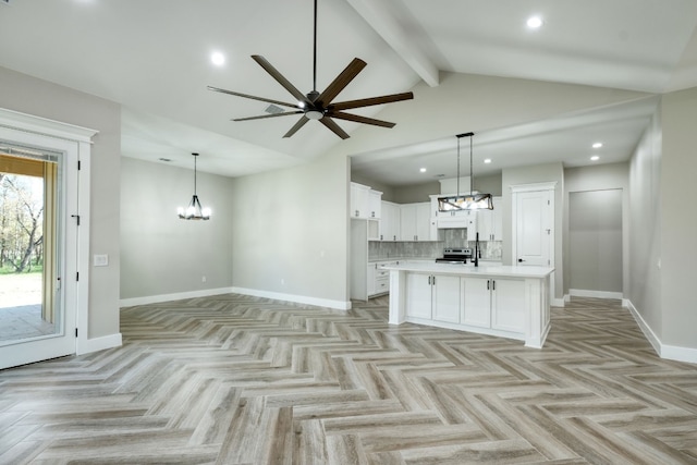 kitchen with stainless steel electric stove, pendant lighting, an island with sink, white cabinets, and light parquet floors