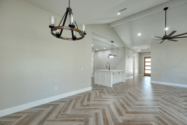 unfurnished living room with sink, beam ceiling, high vaulted ceiling, ceiling fan with notable chandelier, and light parquet flooring