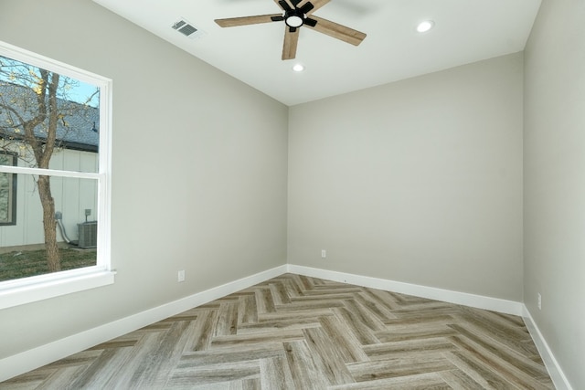 unfurnished room featuring light parquet floors and ceiling fan