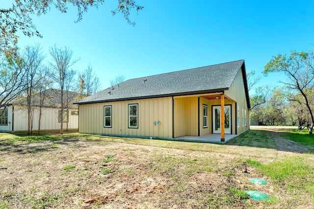 rear view of property with a patio area and a lawn