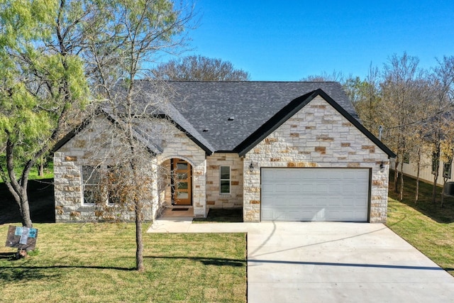 view of front of house with a garage and a front lawn