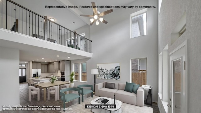 living room featuring ceiling fan and light wood-type flooring