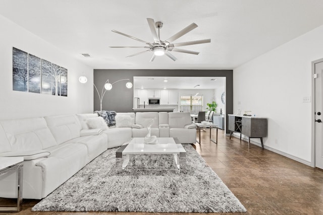 living room with ceiling fan