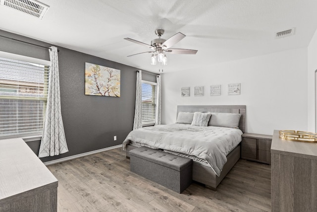 bedroom featuring wood-type flooring and ceiling fan