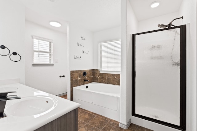 bathroom featuring vanity and shower with separate bathtub