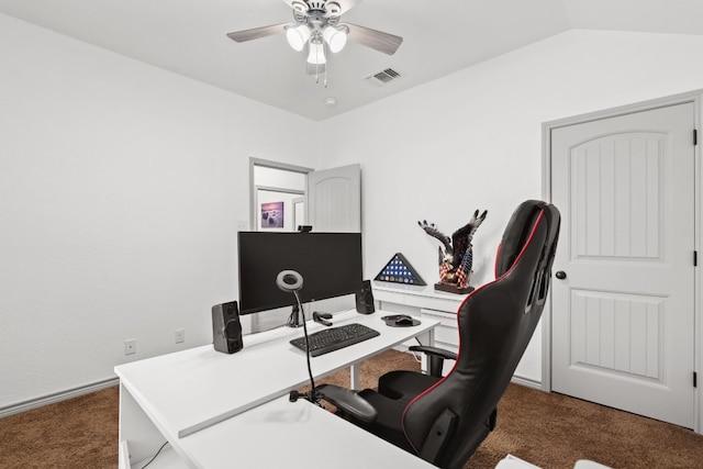 carpeted office featuring vaulted ceiling and ceiling fan