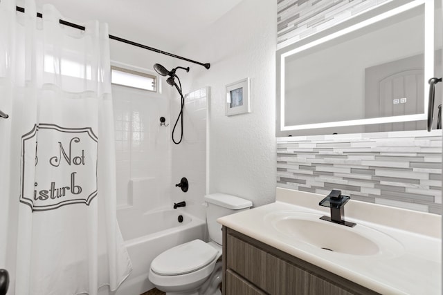 full bathroom featuring toilet, vanity, and shower / bathtub combination with curtain