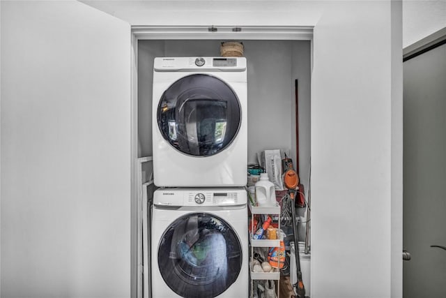 laundry area with stacked washer and clothes dryer