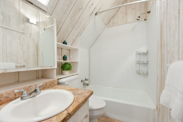 full bathroom with vanity, toilet,  shower combination, and a skylight