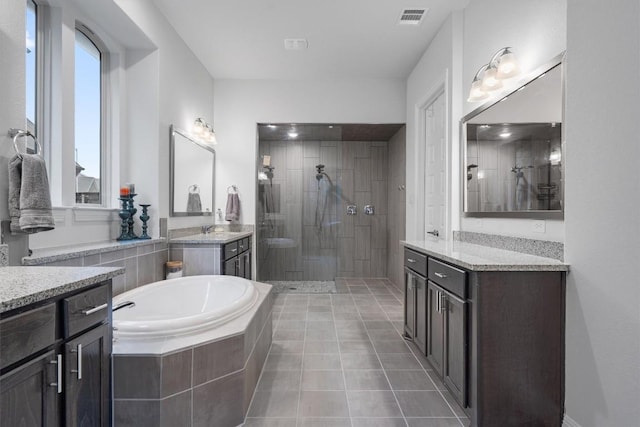 bathroom with vanity, separate shower and tub, and tile patterned flooring