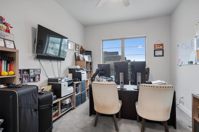 office featuring ceiling fan and light carpet