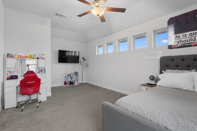 carpeted bedroom featuring ceiling fan and vaulted ceiling