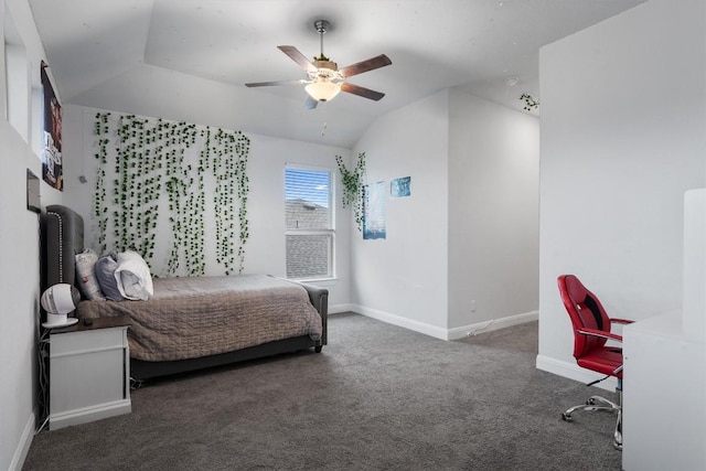 bedroom featuring dark colored carpet, lofted ceiling, and ceiling fan