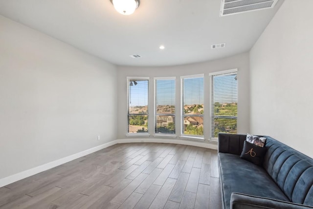 unfurnished living room featuring light hardwood / wood-style flooring