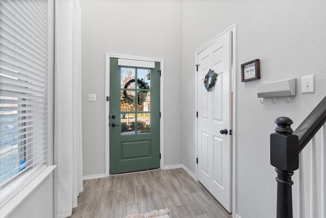 foyer entrance with light wood-type flooring