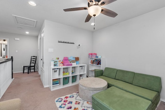 recreation room with light colored carpet