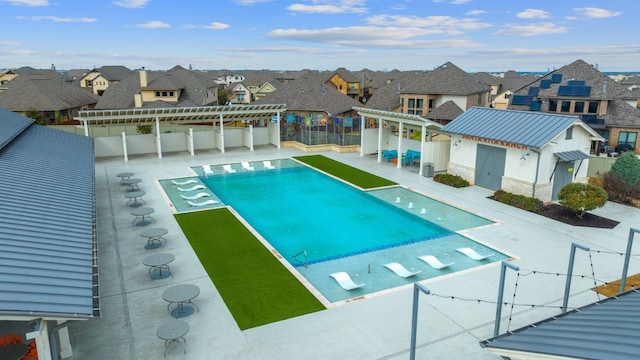 view of pool with a pergola and a patio area