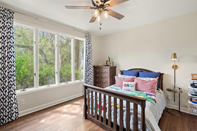 bedroom featuring ceiling fan and light hardwood / wood-style floors