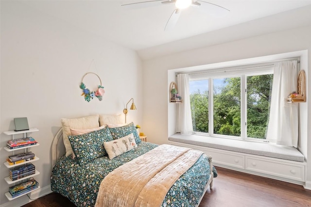 bedroom featuring ceiling fan, lofted ceiling, and dark hardwood / wood-style flooring