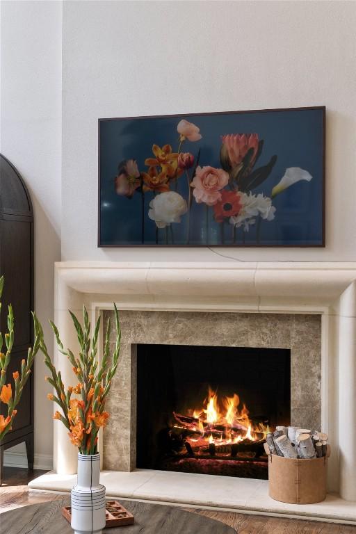 interior details with hardwood / wood-style floors and a fireplace