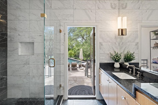 bathroom featuring vanity and walk in shower