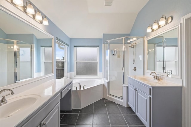 bathroom with tile patterned floors, vanity, separate shower and tub, and lofted ceiling