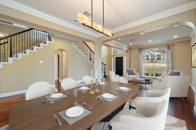 dining room featuring crown molding and dark wood-type flooring