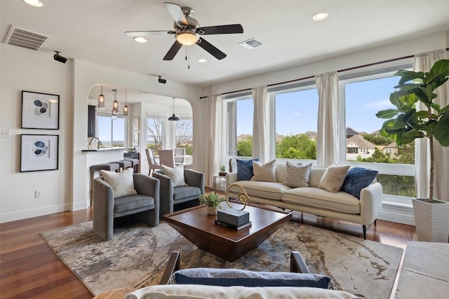 10709 Pointe View Dr, Austin, TX 78738 - living area with a ceiling fan, arched walkways, recessed lighting, and wood finished floors