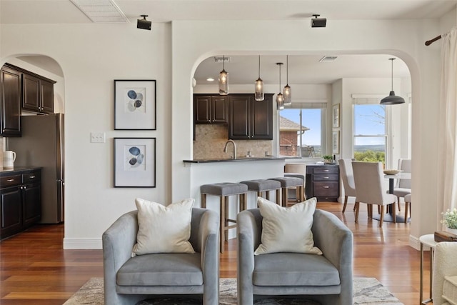 10709 Pointe View Dr, Austin, TX 78738 - living room featuring arched walkways and dark wood-style floors